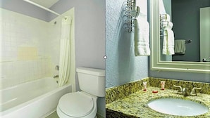 A bathroom with a bathtub, toilet, and granite countertop sink.