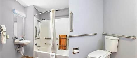 Baño con ducha, inodoro y lavamanos, equipado con barras de apoyo y un perchero para toallas.