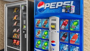 A vending machine with Pepsi branding and a selection of beverages. - Rodeway Inn (Barboursville)