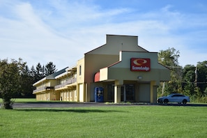 Situated on a grassy area, this motel offers a tranquil setting with a flat roof and simple design.