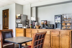 Guests can prepare meals and beverages in this fully equipped kitchen with a coffee machine, refrigerator, and coffee dispenser.