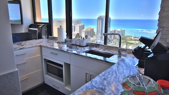Suite, 1 King Bed, Ocean View, Corner (High Floor) | Desk, iron/ironing board, free WiFi, bed sheets at Holiday Inn Express Waikiki, an IHG Hotel