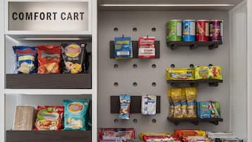 A comfort cart stocked with snacks, beverages, and condiments.