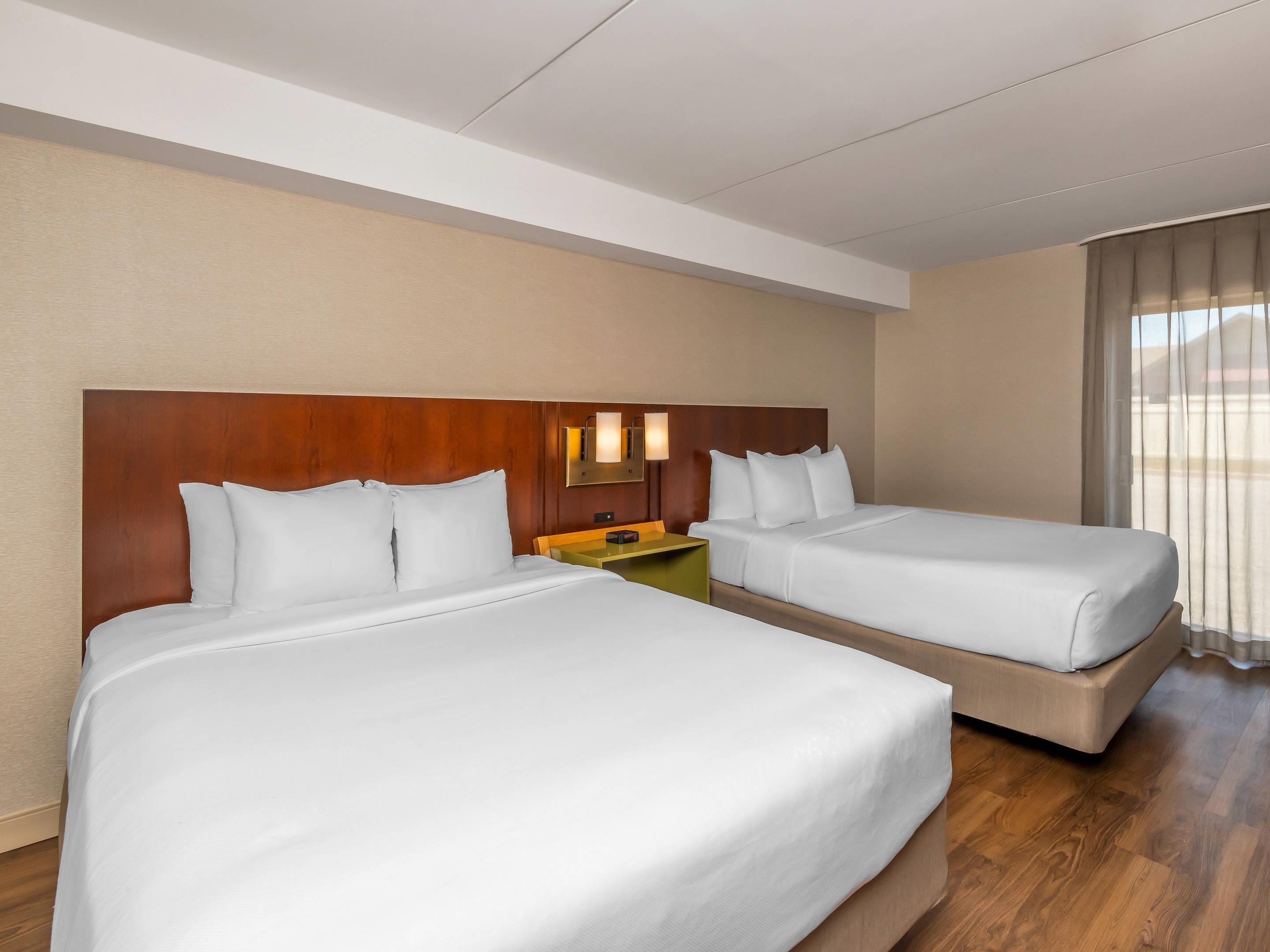 Premium bedding, pillowtop beds, desk, laptop workspace