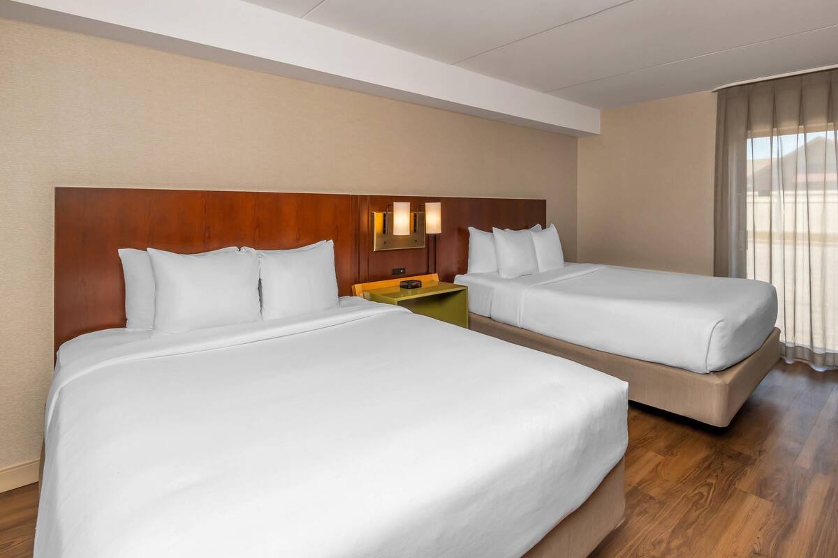 Premium bedding, pillowtop beds, desk, laptop workspace