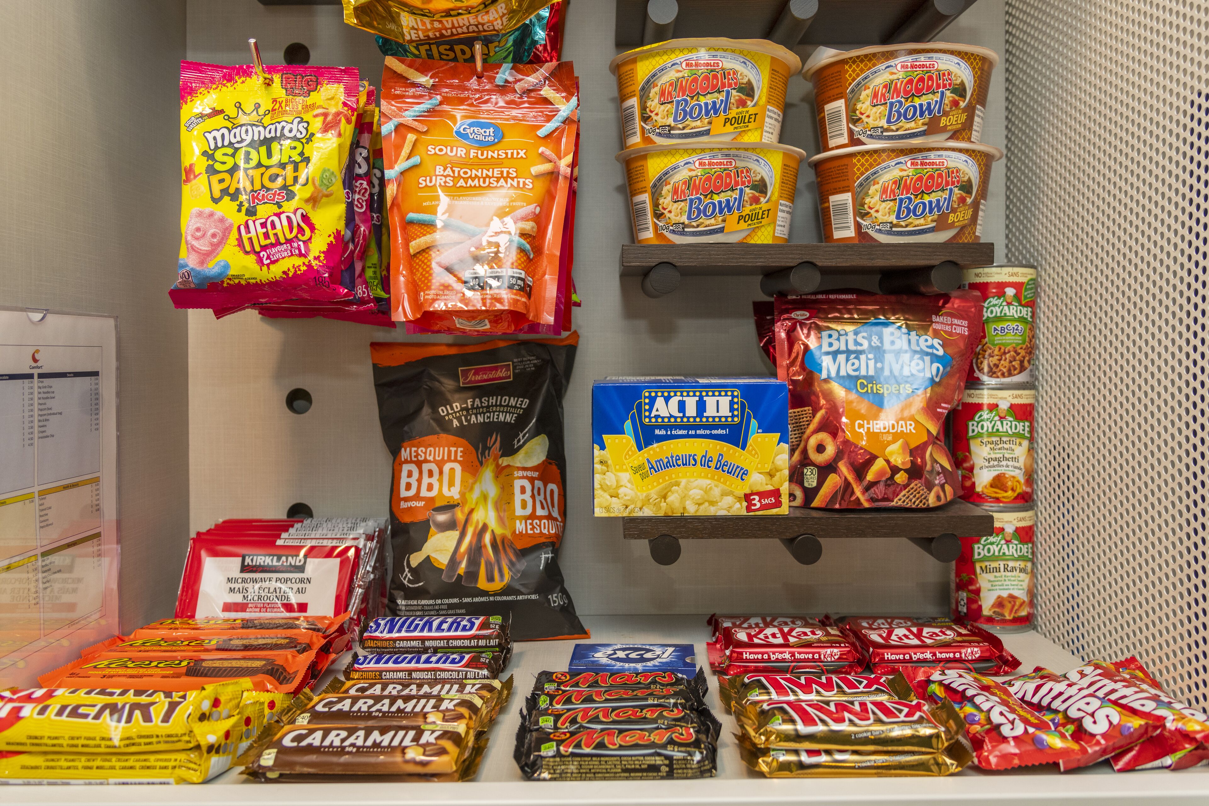 A snack display with various brands and types of snacks.