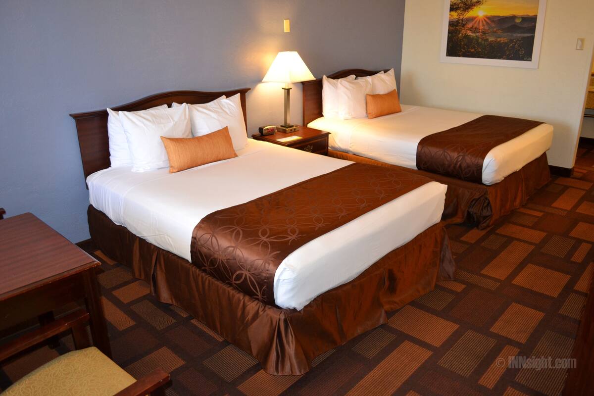 Pillowtop beds, desk, blackout drapes, iron/ironing board