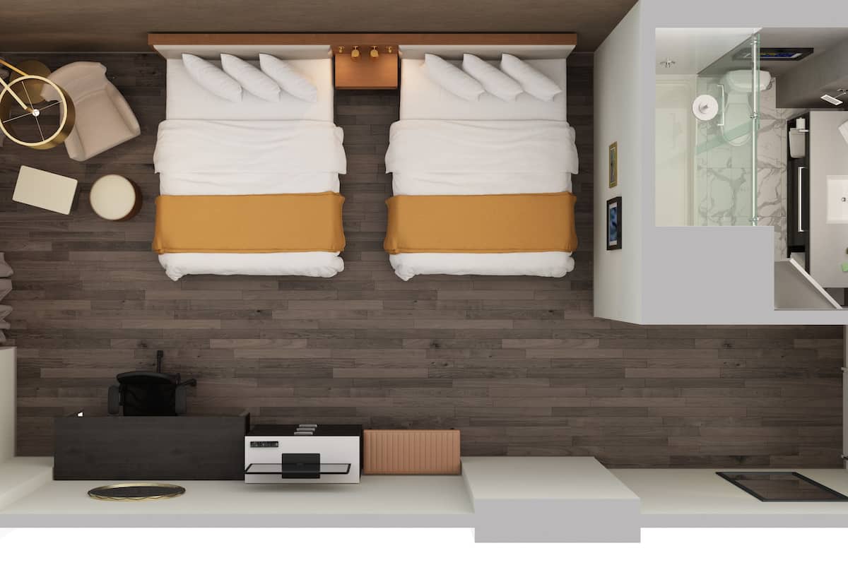A modern hotel room with two beds, a small kitchenette, a bathroom with a glass shower, and a view of the city.