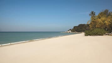 On the beach, white sand, beach massages, beach volleyball