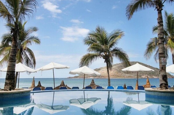 Outdoor pool, open 8 AM to 7 PM, pool umbrellas, pool loungers