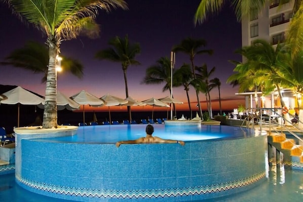 Outdoor pool, open 8 AM to 7 PM, pool umbrellas, sun loungers