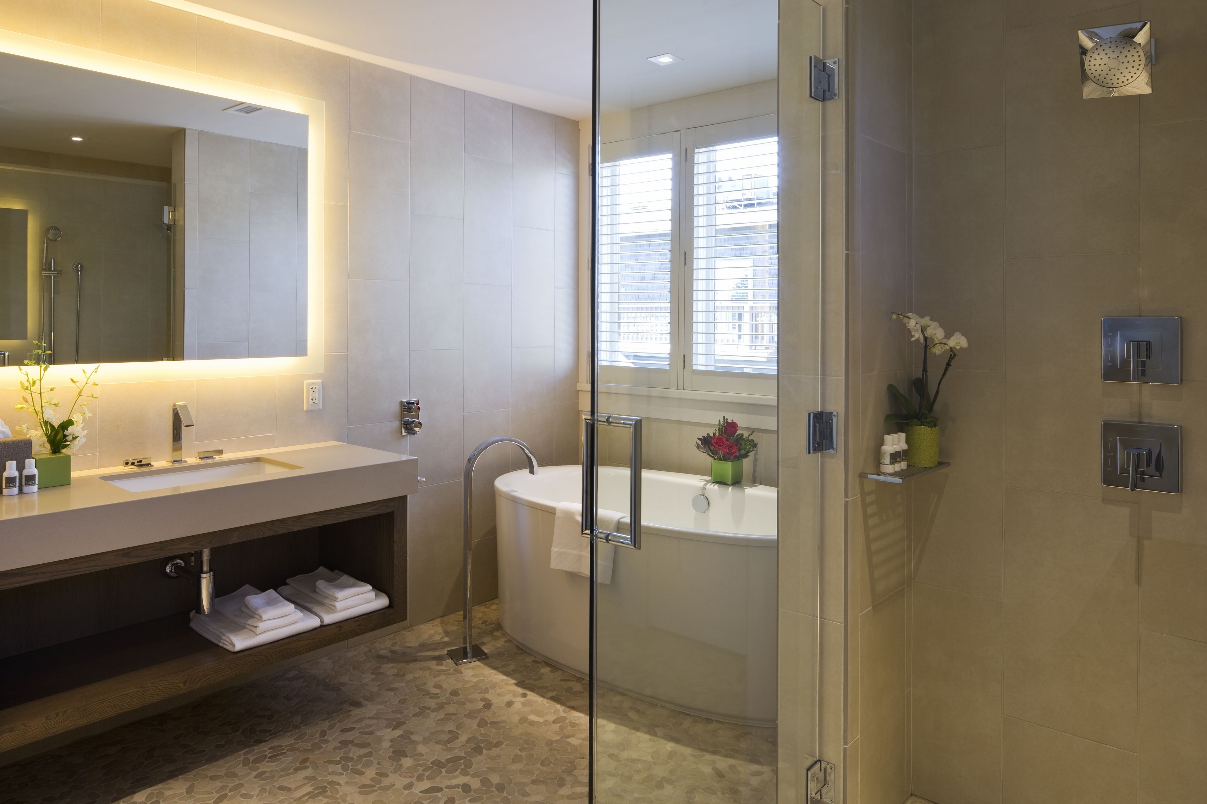 designer toiletries, hair dryer, bathrobes, slippers