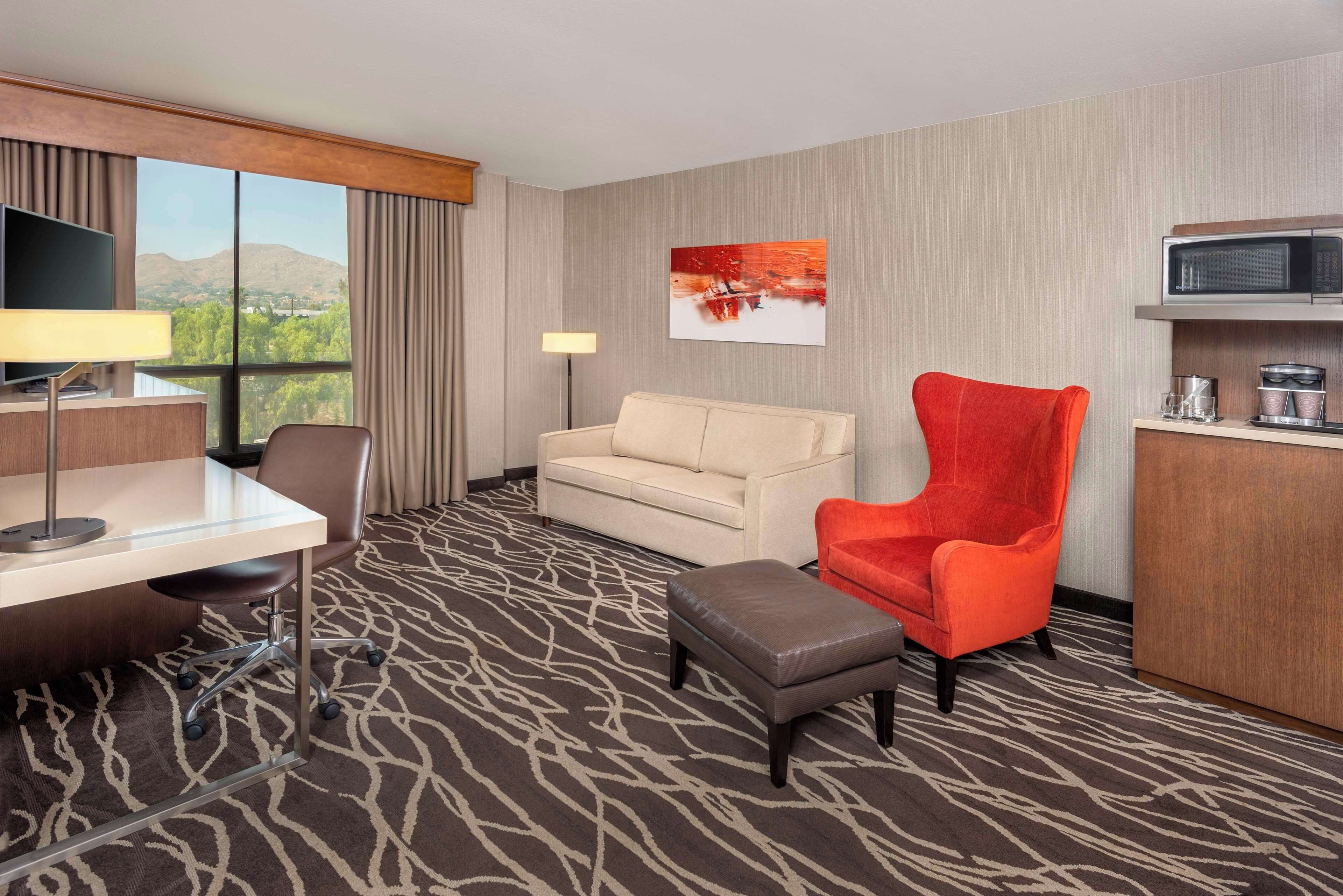 Junior Suite, 1 King Bed with Sofa bed | Living area | 50-inch LED TV with cable channels