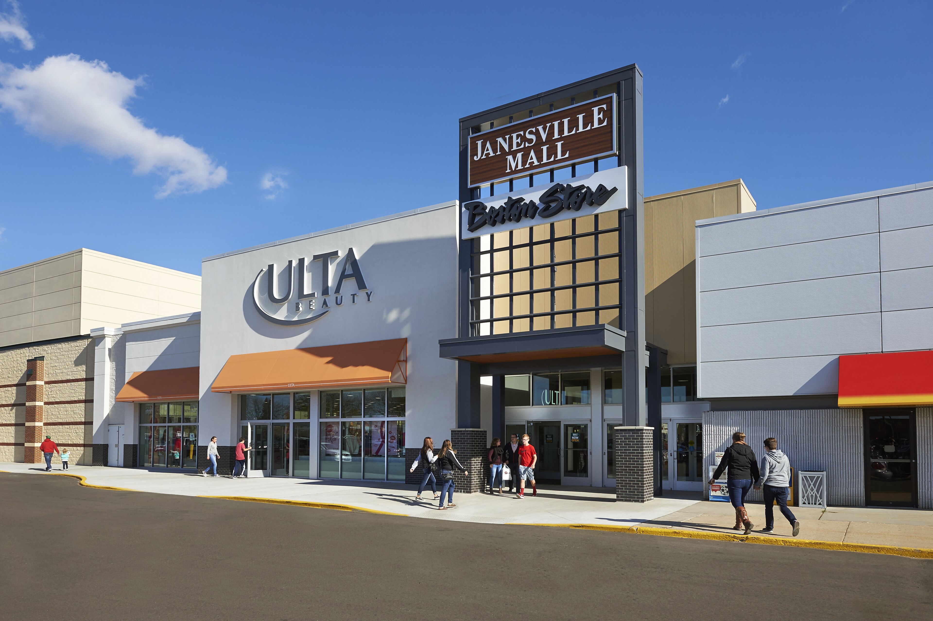 A building with a sign for Janesville Mall and a store named Cult Beauty.