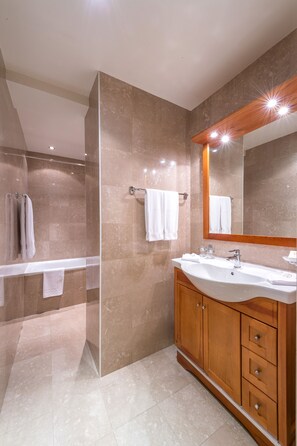 Bathtub, deep soaking tub, eco-friendly toiletries, hair dryer