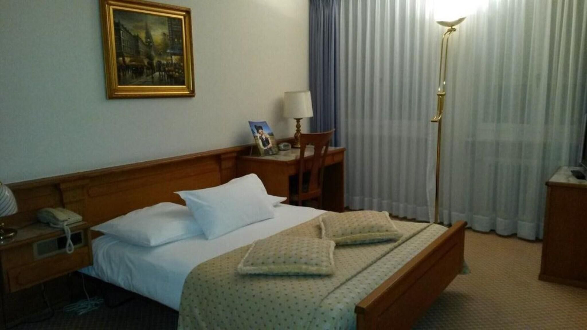 Minibar, desk, iron/ironing board
