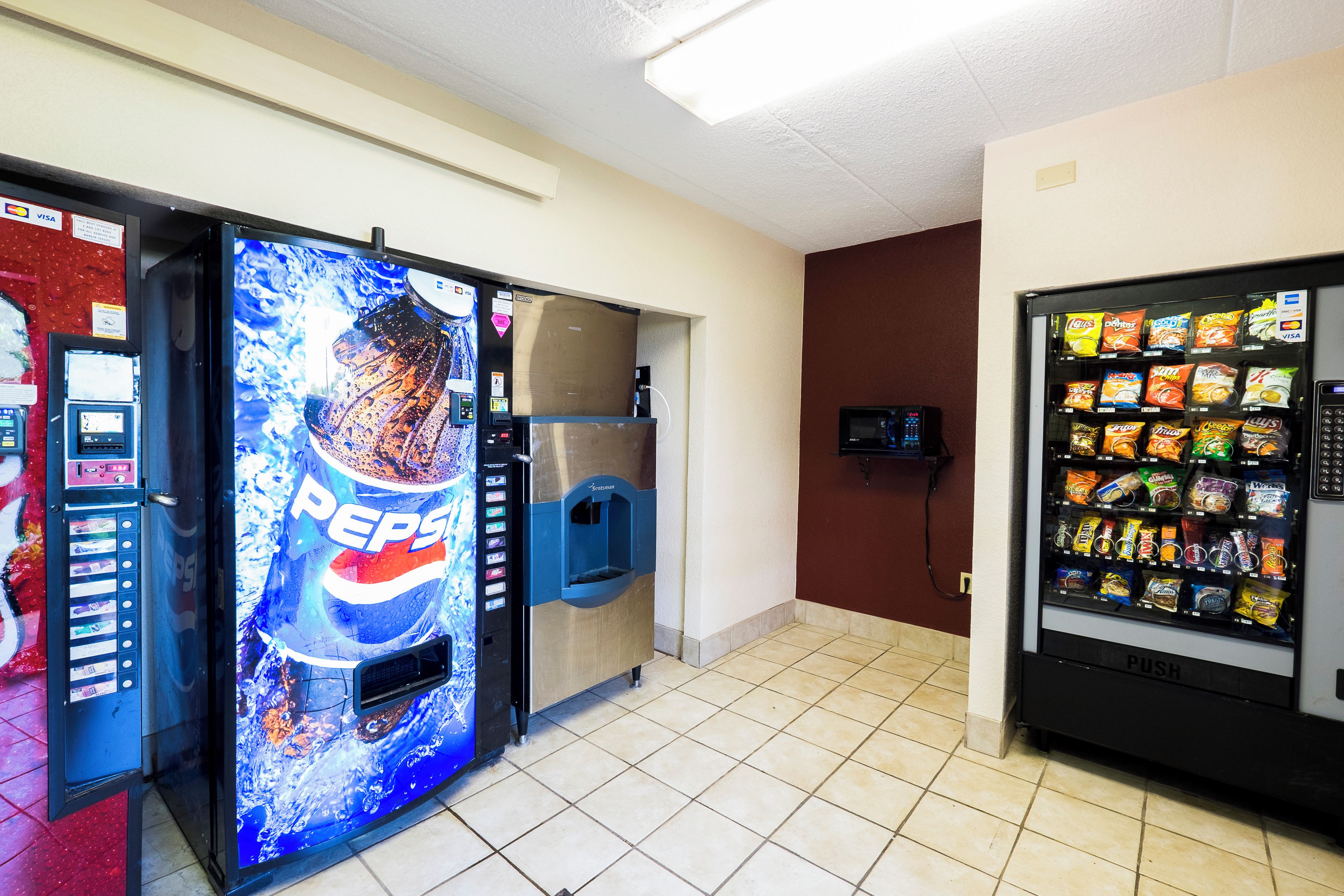A vending area with a Pepsi machine and a snack vending machine.