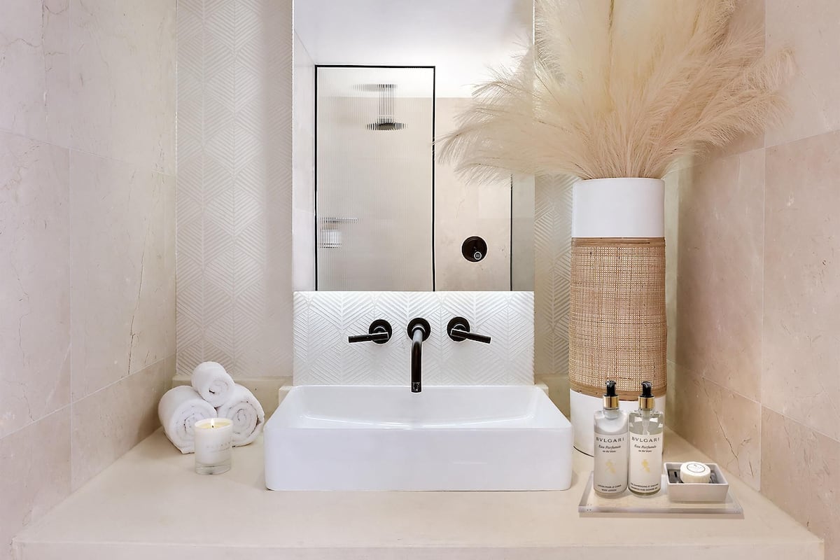signature suite | bathroom | designer toiletries, hair dryer, bathrobes, slippers
