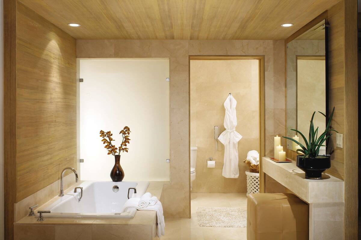 signature suite | bathroom | designer toiletries, hair dryer, bathrobes, slippers