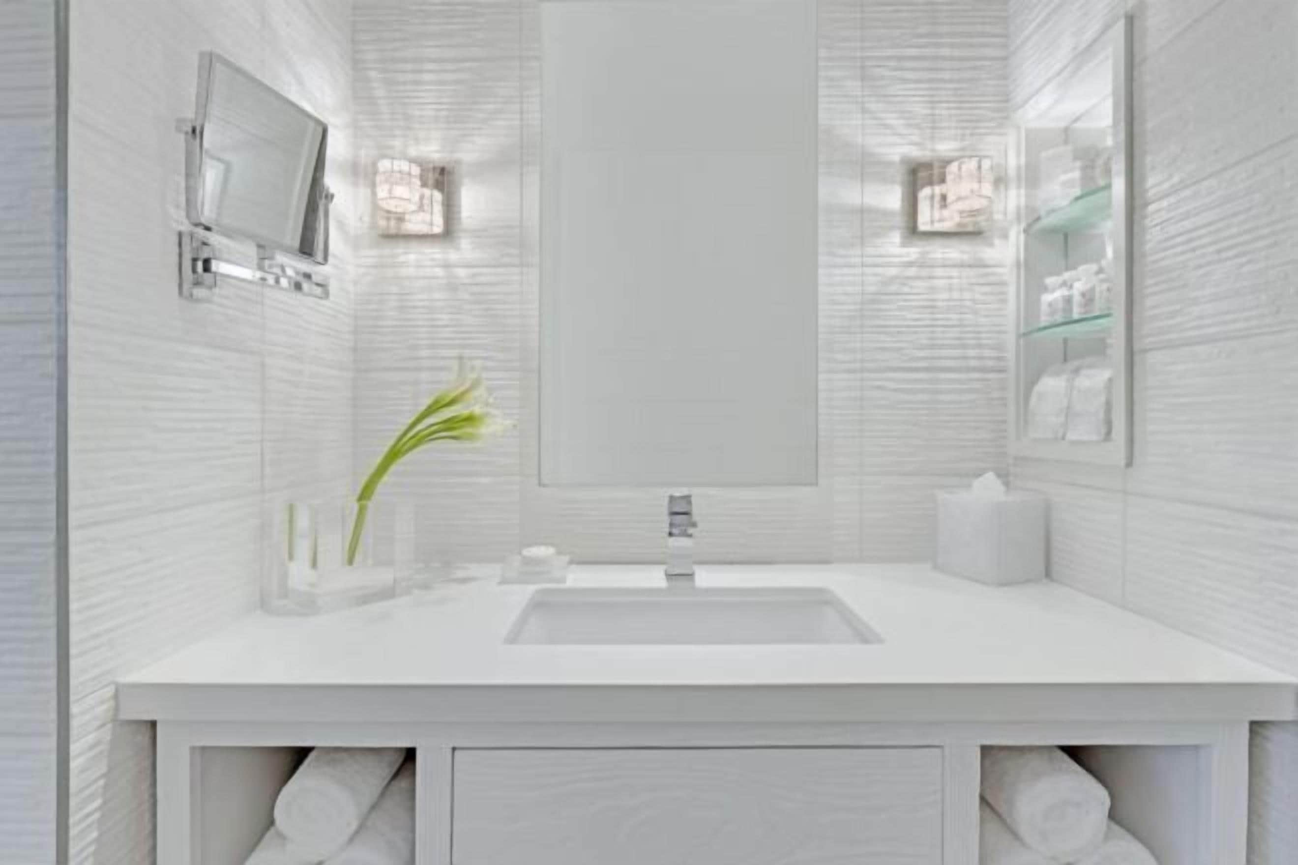 Designer toiletries, hair dryer, bathrobes, slippers