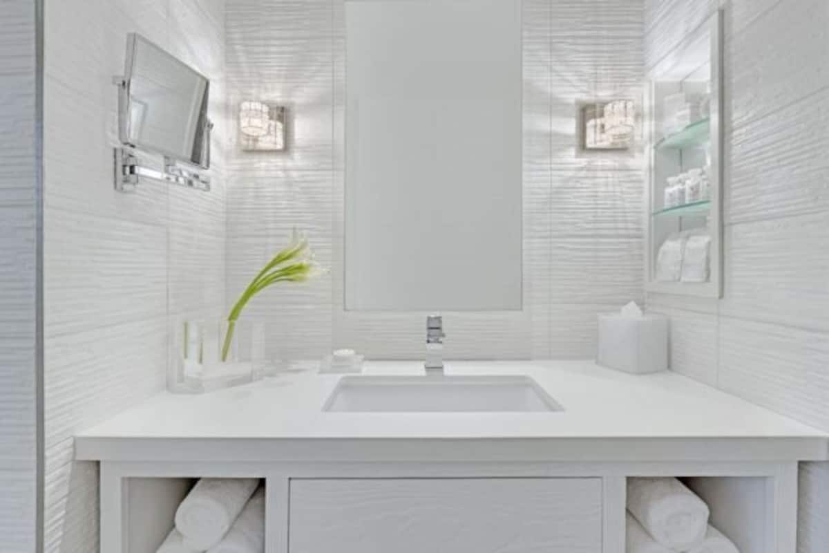 Designer toiletries, hair dryer, bathrobes, slippers
