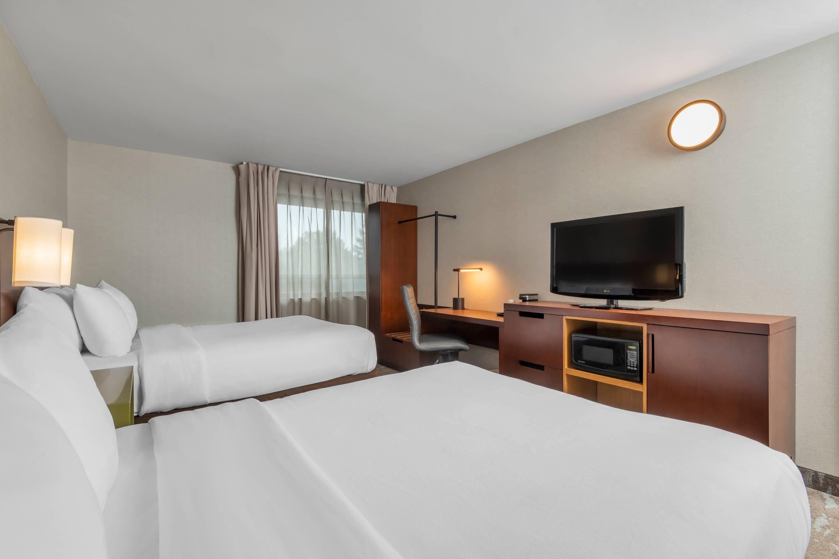Premium bedding, pillowtop beds, desk, blackout drapes