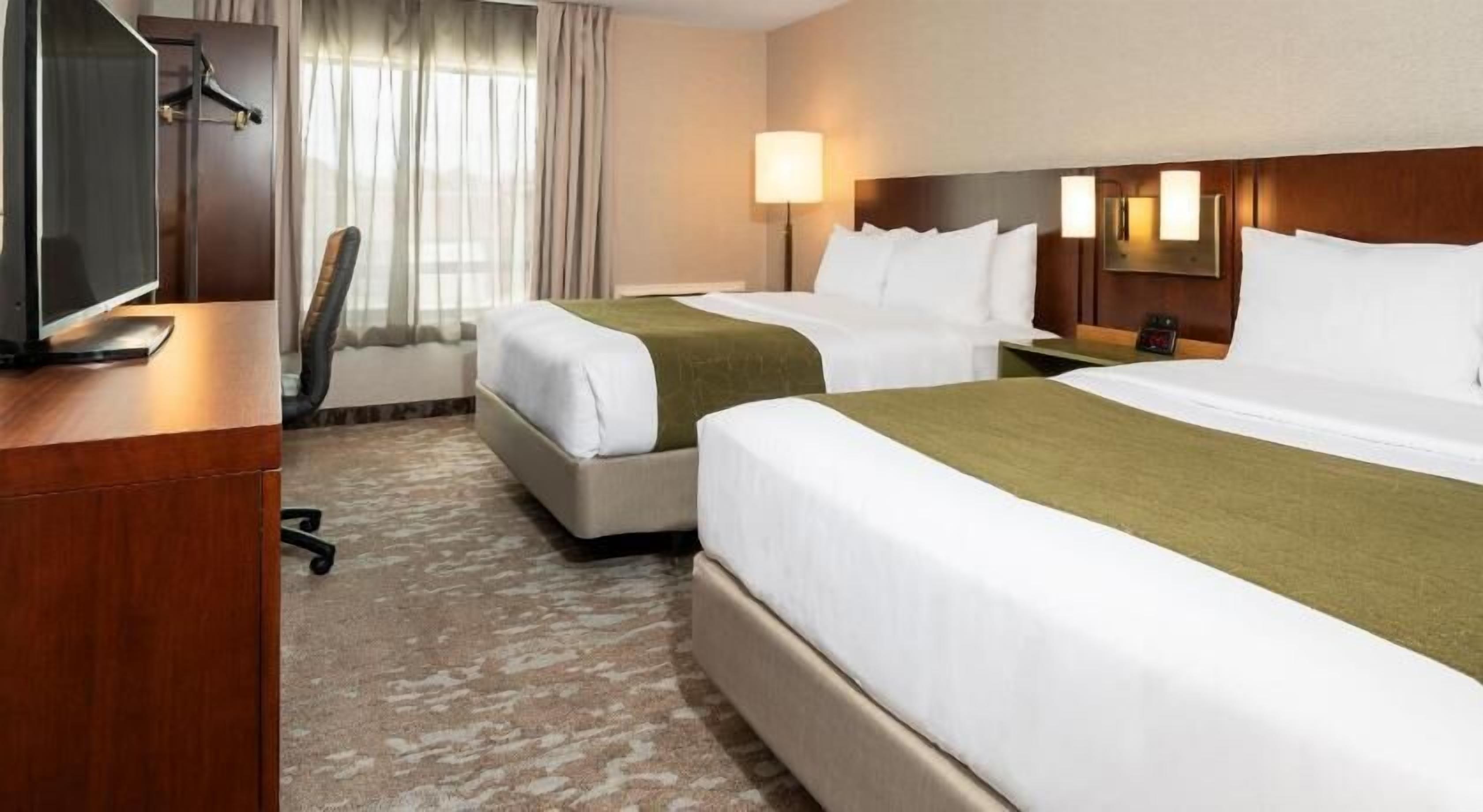 Premium bedding, pillowtop beds, desk, blackout drapes