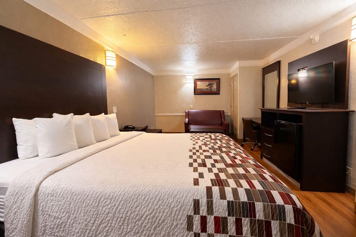 Desk, laptop workspace, blackout curtains, iron/ironing board