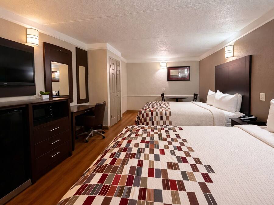 Desk, laptop workspace, blackout drapes, iron/ironing board