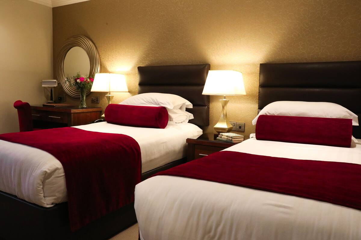 classic twin room | egyptian cotton sheets, down duvets, pillow-top beds, in-room safe