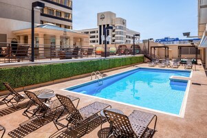 Seasonal outdoor pool, open 9:00 AM to 8:00 PM, sun loungers