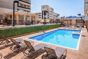 Seasonal outdoor pool, open 9:00 AM to 7:00 PM, sun loungers