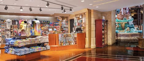 A retail store with various clothing items and accessories on display.