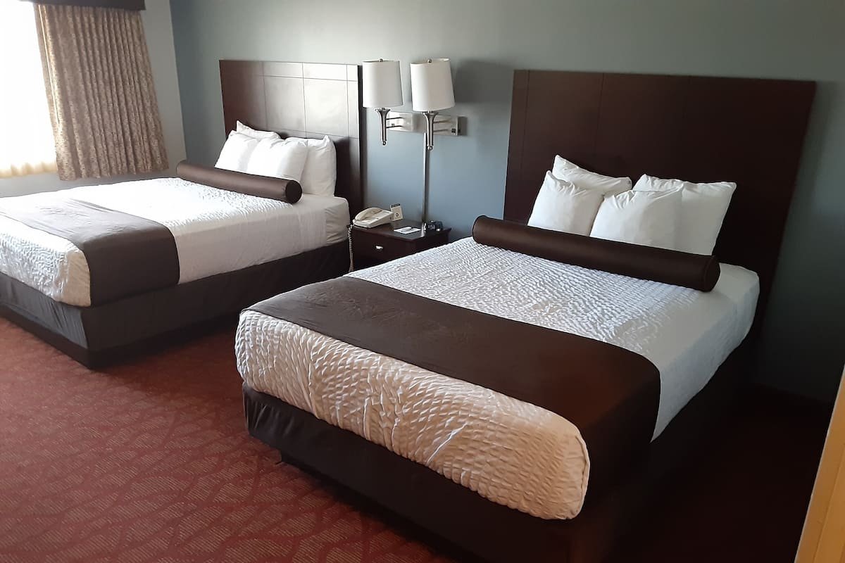 room, 2 queen beds, non smoking | in-room safe, desk, laptop workspace, blackout curtains