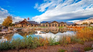 Situated beside a serene pond, this lodge offers a scenic view.