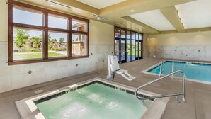 A swimming pool area with a hot tub, a sunroof, and a view of the outdoors. - Best Western Plus High Country Inn (Ogden)