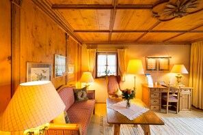 Suite, 1 Queen Bed | Living room | Flat-screen TV