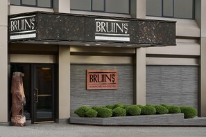 A building with a sign reading "Bruins Alaskan Fare and Cocktails".