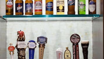 A bar area with multiple beer taps and bottles.