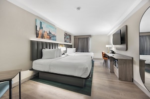 Deluxe Room, 2 Queen Beds, Non Smoking | Desk, soundproofing, iron/ironing board, free cribs/infant beds