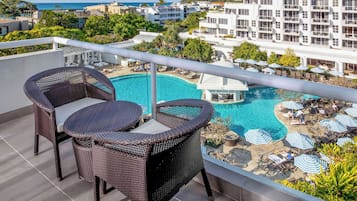 Relax on the balcony with two comfortable chairs and enjoy the view of the resort.