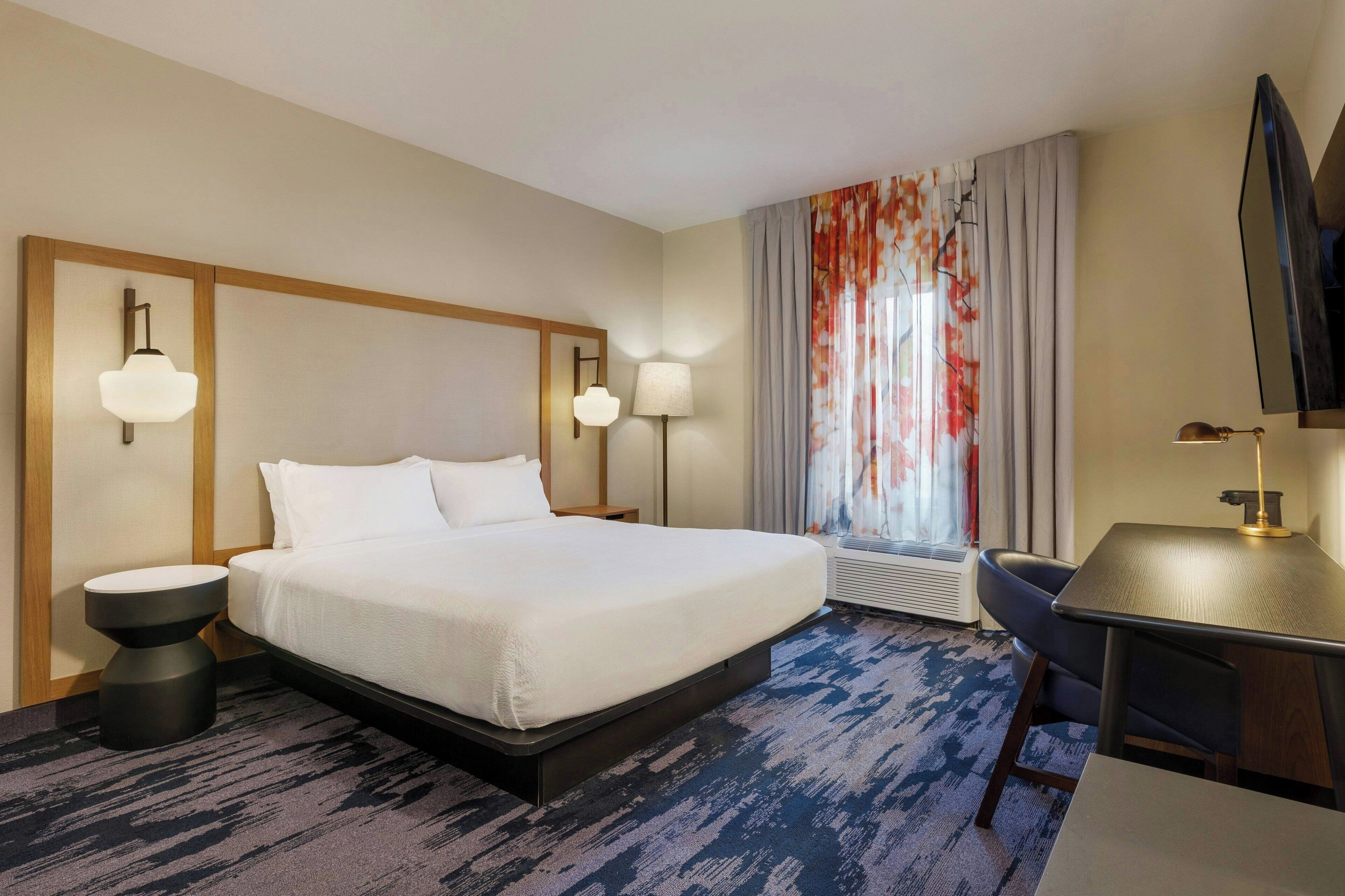 Premium bedding, Tempur-Pedic beds, desk, laptop workspace