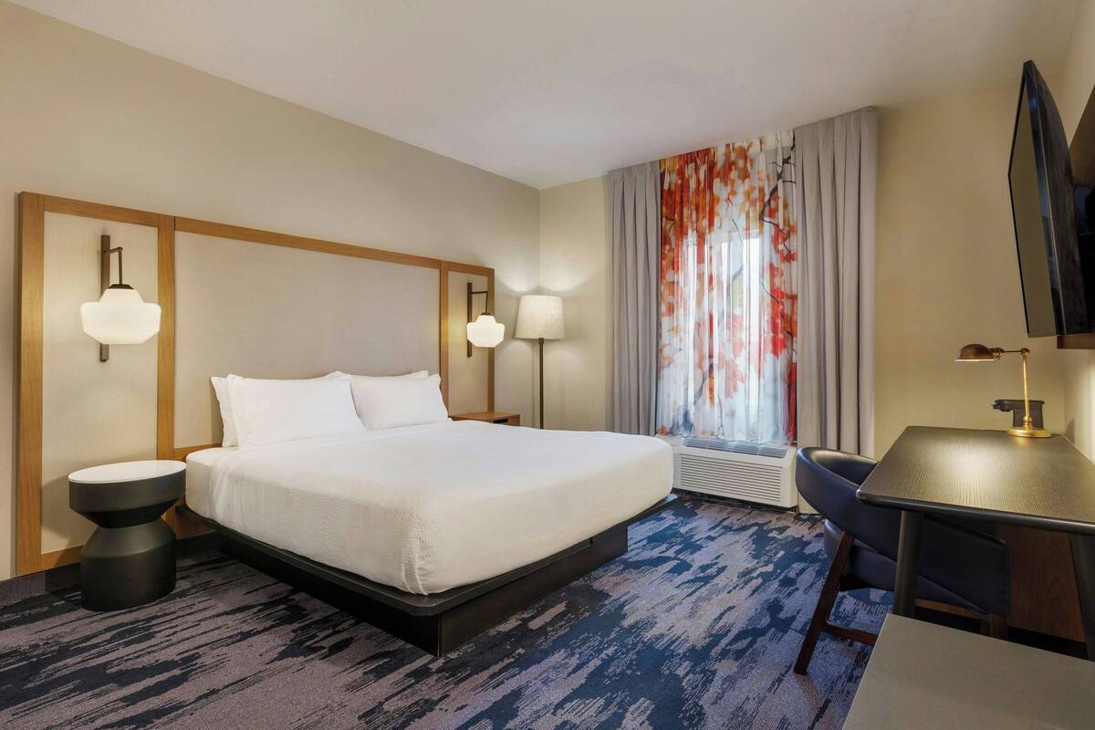 Premium bedding, Tempur-Pedic beds, desk, laptop workspace
