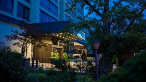 A hotel entrance with a modern facade, a well-lit entrance area, and a visible signboard. - The Ven at Embassy Row, Washington, D.C., a Tribute Portfolio Hotel (Washington)