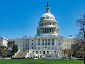 A large, white, neoclassical building with a prominent dome and columns, surrounded by a well-maintained lawn and a few trees. - The Ven at Embassy Row, Washington, D.C., a Tribute Portfolio Hotel (Washington)