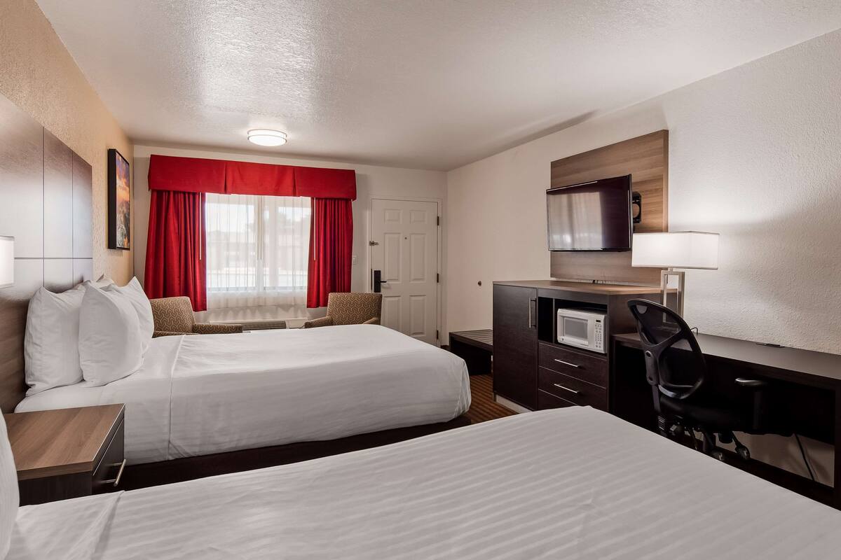 premium bedding, pillow-top beds, desk, laptop workspace