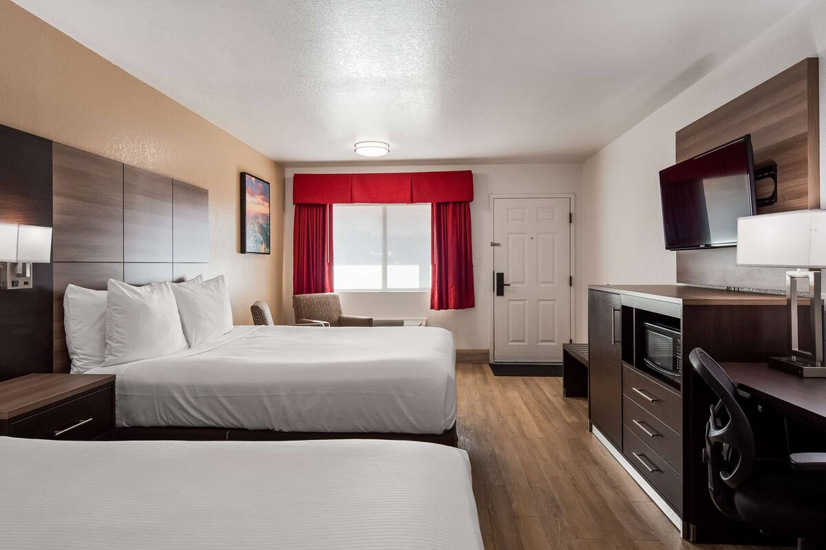 premium bedding, pillow-top beds, desk, laptop workspace