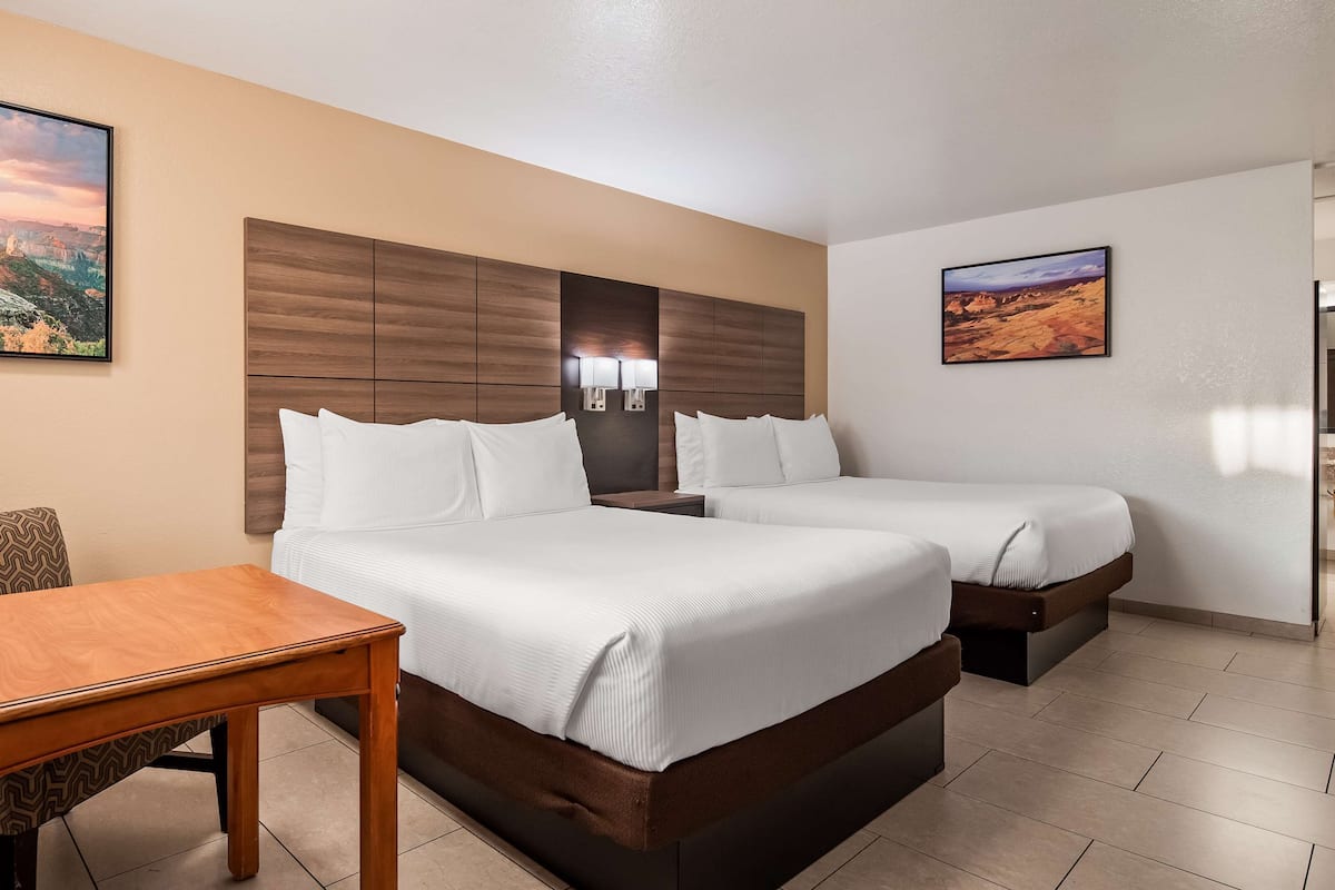 Premium bedding, pillow-top beds, desk, laptop workspace