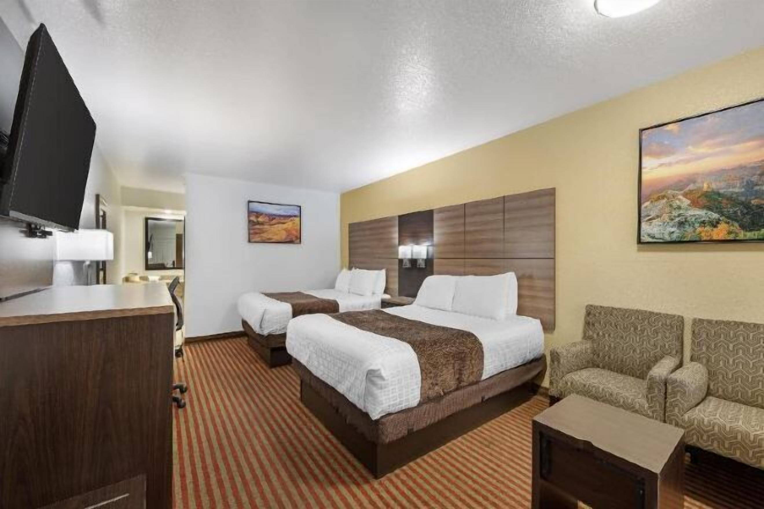 Premium bedding, pillowtop beds, desk, laptop workspace