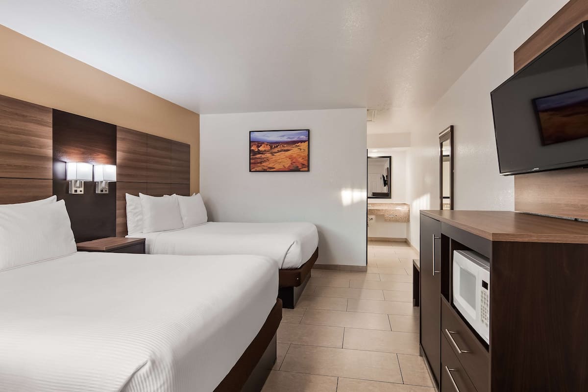 premium bedding, pillow-top beds, desk, laptop workspace